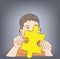 Boy holding a puzzle in his hands. symbol of autism. vector illustration.