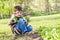 Boy holding radishes Spring garden