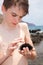 Boy holding sea hedgehog