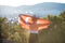 Boy holding Turkey flag against city. Kid hand waving Turkish flag view from back, copy space for text