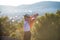 Boy holding Turkey flag against city. Kid hand waving Turkish flag view from back, copy space for text