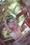 Boy holding watermelon as hat