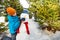 Boy holds carrot to put as nose of snowman