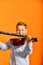 Boy holds dombra and clarinet