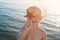 Boy holds starfish. Portrait of blond child on sea background. marine and aquatic life