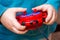 Boy holds toy control panel, mastering modern technologies_