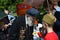 A boy honoring war veteran man. Gorky park in Moscow