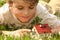 Boy and house model in grass