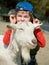 Boy hugging a goat