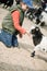 Boy hugging a goat