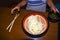 Boy hungry waiting for dinner in restaurant