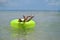 Boy in inflatable beach ring