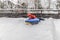 Boy with the inflatable sledge, snow tube