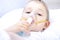 Boy with an inhaler mask - respiratory problems