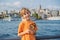 Boy in Istanbul having breakfast with Simit and a glass of Turkish tea. Glass of Turkish tea and bagel Simit against