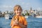 Boy in Istanbul having breakfast with Simit and a glass of Turkish tea. Glass of Turkish tea and bagel Simit against