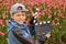 Boy in jacket and cap with cinema clapper board