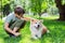 Boy with Japanese dog Akita inu in the park