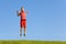 Boy jump high over sky lifting hands and smile