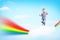 Boy jumping on clouds and a rainbow