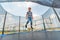 The boy jumps on a trampoline in an amusement park, performing various stunts