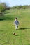 Boy Kicking Colorful Soccer Ball in Field