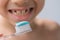 Boy, kid 6-7 years old diligently brushes teeth and colored children`s paste, dental concept, oral hygiene, daily morning routine