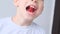 Boy, kid holds in his mouth and eats gelatinous sweets, gummy bear, concept of children`s delicacy, healthy and unhealthy food,