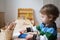 Boy in kindergarden with drawing crayons