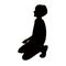 A boy kneeling down, silhouette vector