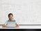 Boy With Laptop Sitting In Classroom