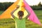 The boy launches a kite. Summer day. Sunny.The boy in a yellow t-shirt with a kite