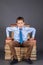 Boy leader sitting on the throne from books