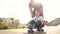 Boy learn to skateboard. Dad teaches son to ride a skateboard outdoors at the playground. Father and boy lifestyle play