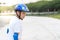 Boy learning skating outdoor, sweats on his face..