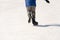 Boy legs in ice skates hockey and figure skating