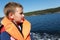 Boy in life jacket in Ladoga skerries