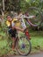 Boy Lifting Bicycle