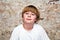 Boy with light brown hair and brown