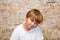 Boy with light brown hair and brown