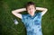 Boy listening to music on grass