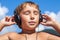 Boy listens to music on headphones