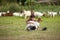 The boy lives in the countryside by raising goats