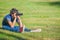 Boy Looking Through Binoculars  Sitting in Grass