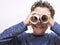 Boy looking through binoculars toilet paper roll stock photo