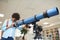 Boy Looking Through Telescope