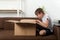 Boy looks into large open box. Child is unpacking large gift