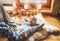 Boy lying on floor on sheepskin and looking in window in cozy home atmosphere. Peaceful moments of cozy home concept image