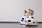 Boy Lying On Floor With Soccer Ball