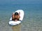 Boy lying on surfs in beach